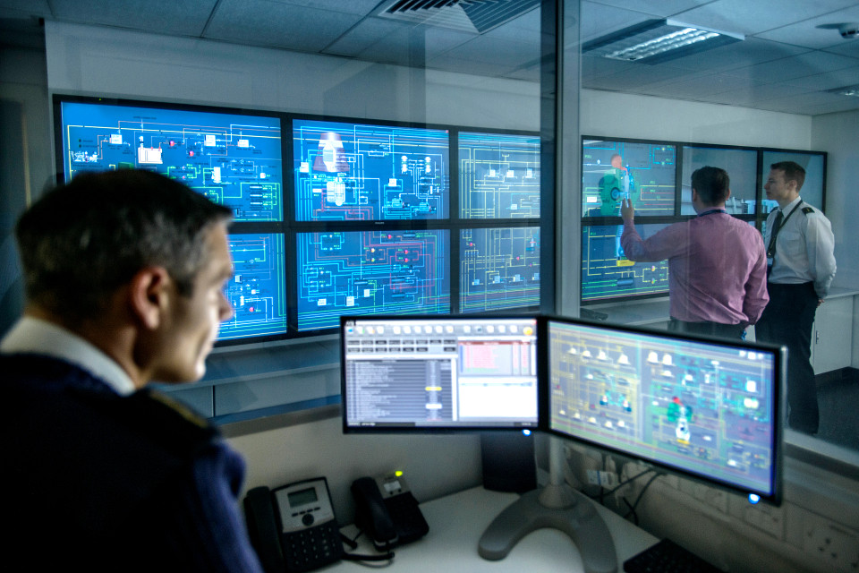 Security operator looking at multiple screens